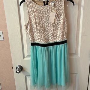 Speechlace lace dress nude/teal with black details